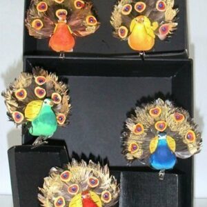 12 Pavos reales con pinza. Color surtido