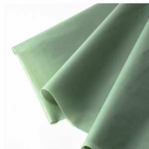 Papel-de-seda-verde-vintage-empolvado-cemento-etiquegrama-valencia